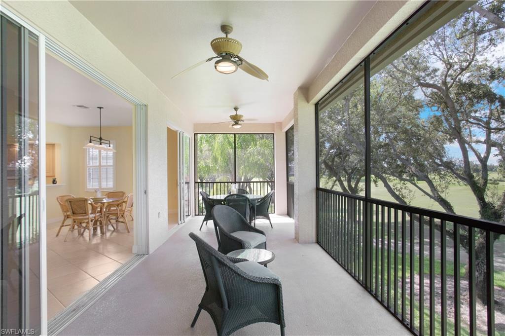 758 Regency Reserve Circle, Unit 2103 Naples, FL 34119 - Photo 32 of 41 a dining room with furniture water view and a garden