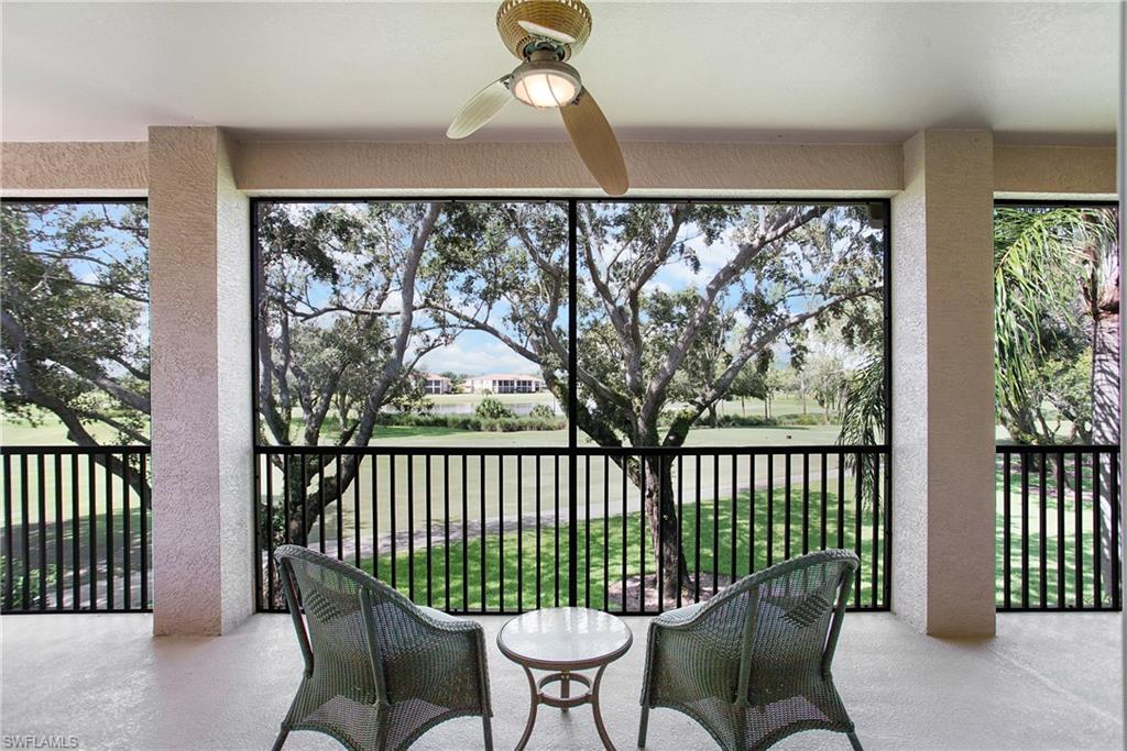 758 Regency Reserve Circle, Unit 2103 Naples, FL 34119 - Photo 33 of 41 a balcony with furniture and wooden floor