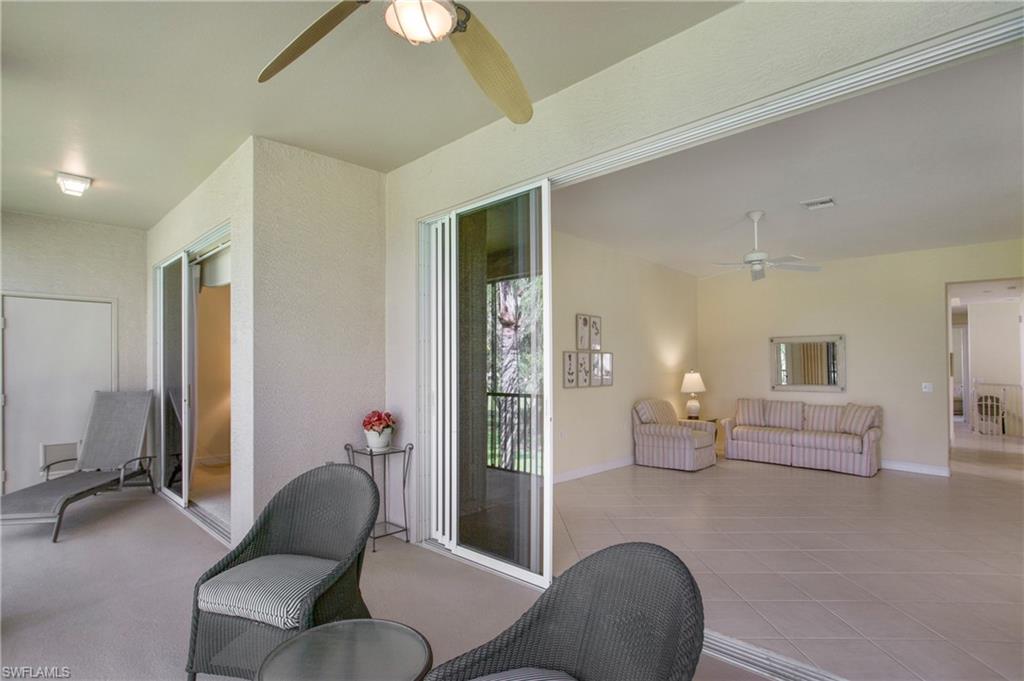 758 Regency Reserve Circle, Unit 2103 Naples, FL 34119 - Photo 34 of 41 a living room with furniture and a window