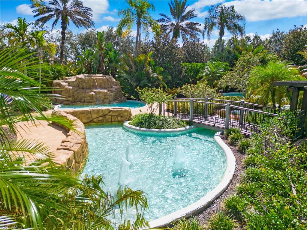 758 Regency Reserve Circle, Unit 2103 Naples, FL 34119 - Photo 40 of 41 a view of a swimming pool with a yard