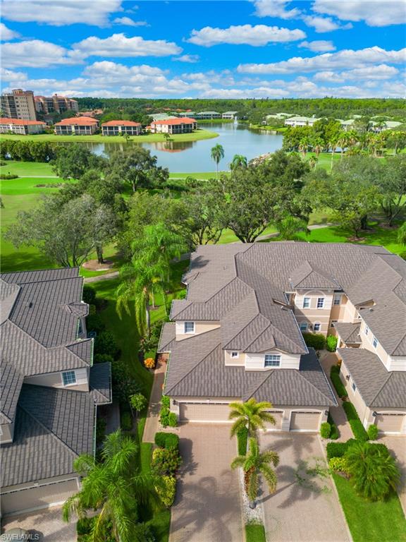 758 Regency Reserve Circle, Unit 2103 Naples, FL 34119 - Photo 4 of 41 a view of an outdoor space with yard and ocean view
