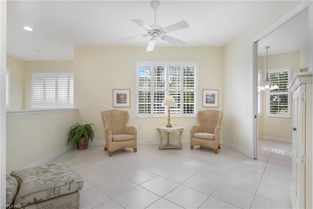 758 Regency Reserve Circle, Unit 2103 Naples, FL 34119 - Photo 8 of 41 a living room with furniture and a window