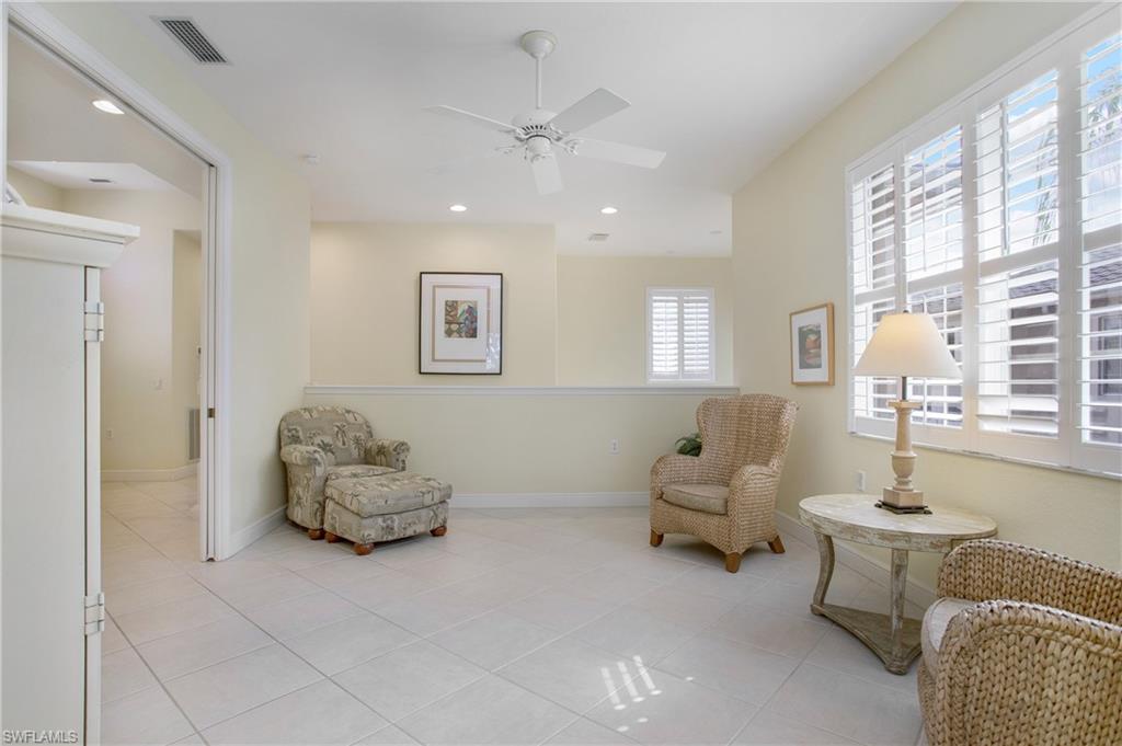 758 Regency Reserve Circle, Unit 2103 Naples, FL 34119 - Photo 10 of 41 a living room with furniture and window