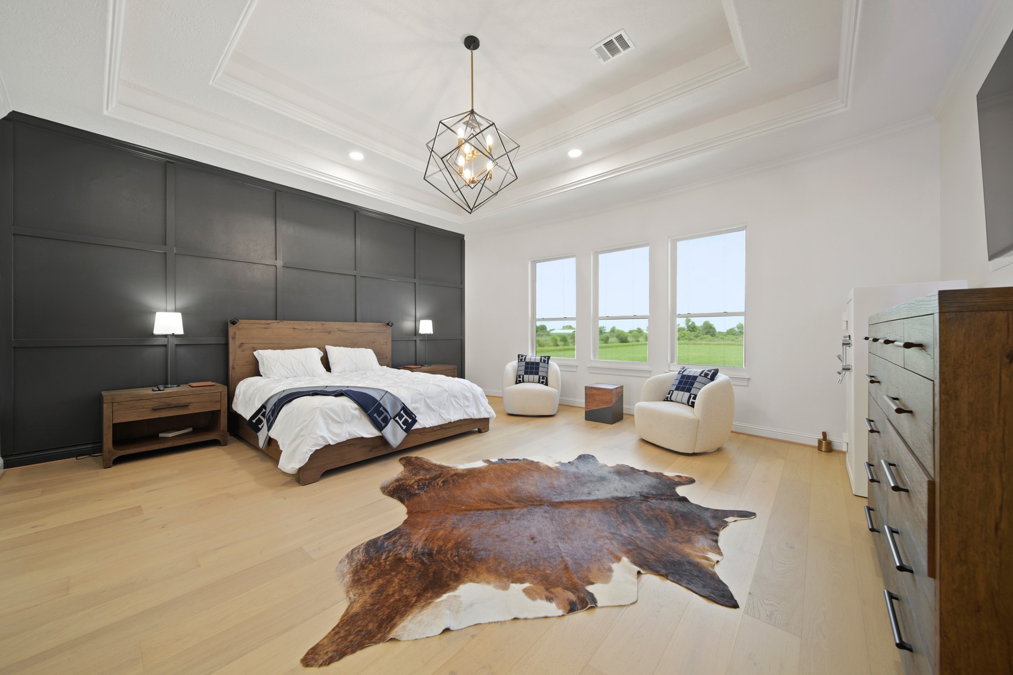 3515 County Road 62 Rosharon, TX 77583 - Photo 20 of 50 Enormous primary bedroom overlooking gorgeous pool with custom tray ceiling, new lighting, and accent wall.