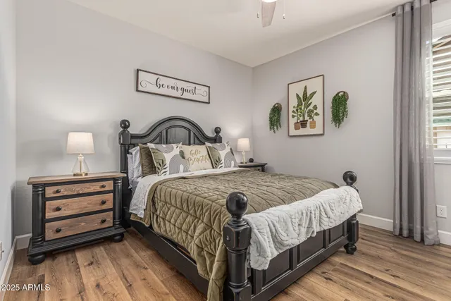 a living room with furniture and flowers