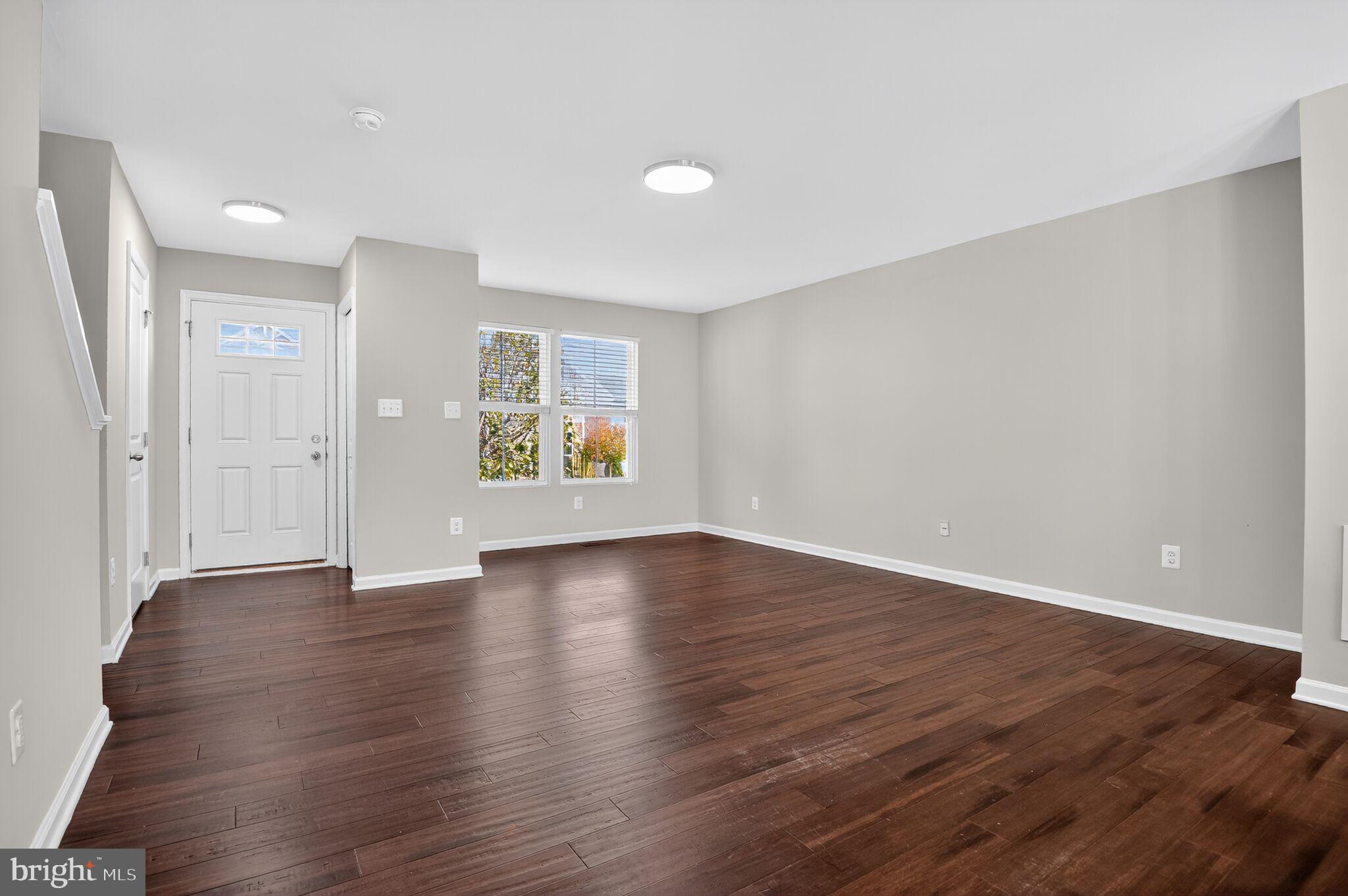 2012 Crepe Myrtle Lane Culpeper, VA 22701 - Photo 8 of 30 an empty room with wooden floor and windows