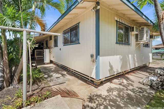 a view of a front door and small yard