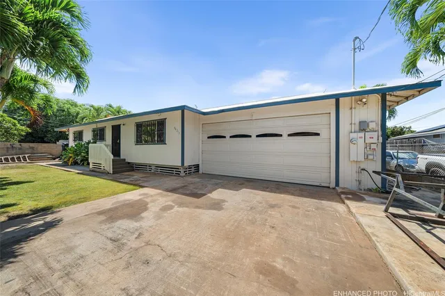 a backyard of a house with yard and outdoor seating