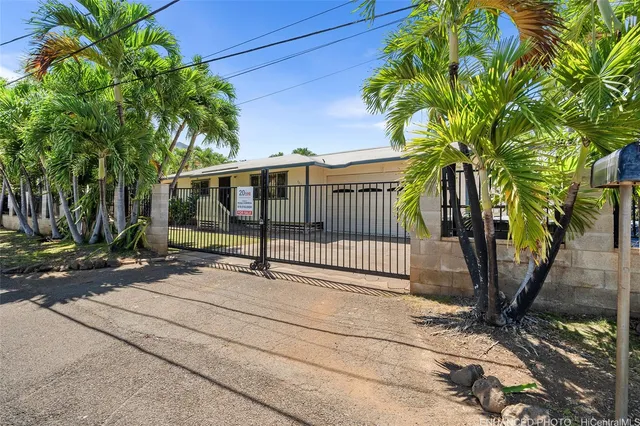 a view of a wrought iron fences in front of house