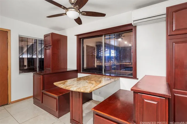 a room with pool table and windows