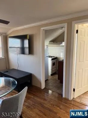 a kitchen with granite countertop a sink and a stove top oven