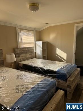 65-67 Monticello Avenue, Unit 3 Newark, NJ 07106 - Photo 8 of 10 a bedroom with a bed and a flat screen tv