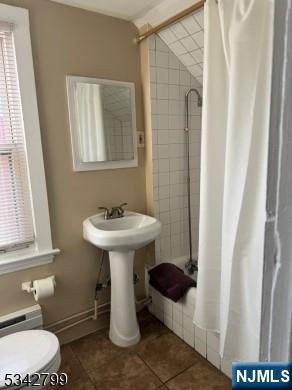 65-67 Monticello Avenue, Unit 3 Newark, NJ 07106 - Photo 9 of 10 a bathroom with a sink toilet and a mirror
