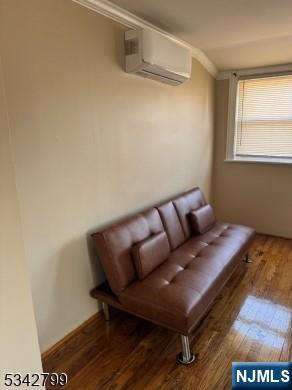 65-67 Monticello Avenue, Unit 3 Newark, NJ 07106 - Photo 10 of 10 a living room with a couch and a table