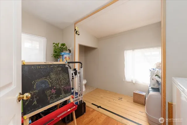 a room with furniture and a potted plant