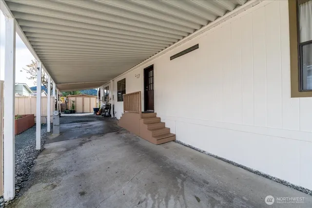 a view of a patio with table and chairs