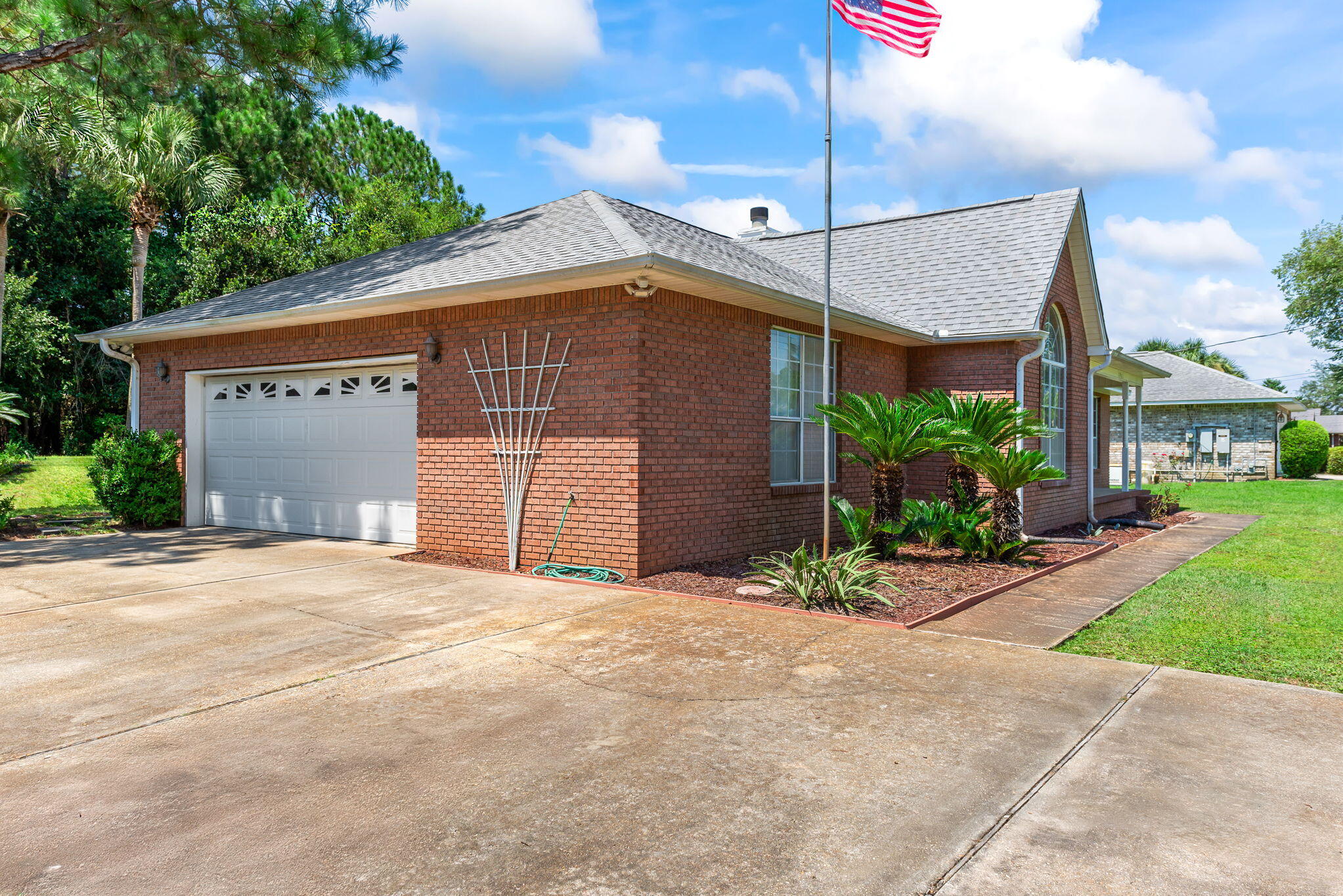 1931 Commodore Drive Navarre, FL 32566 - Photo 4 of 65 garage and driveway