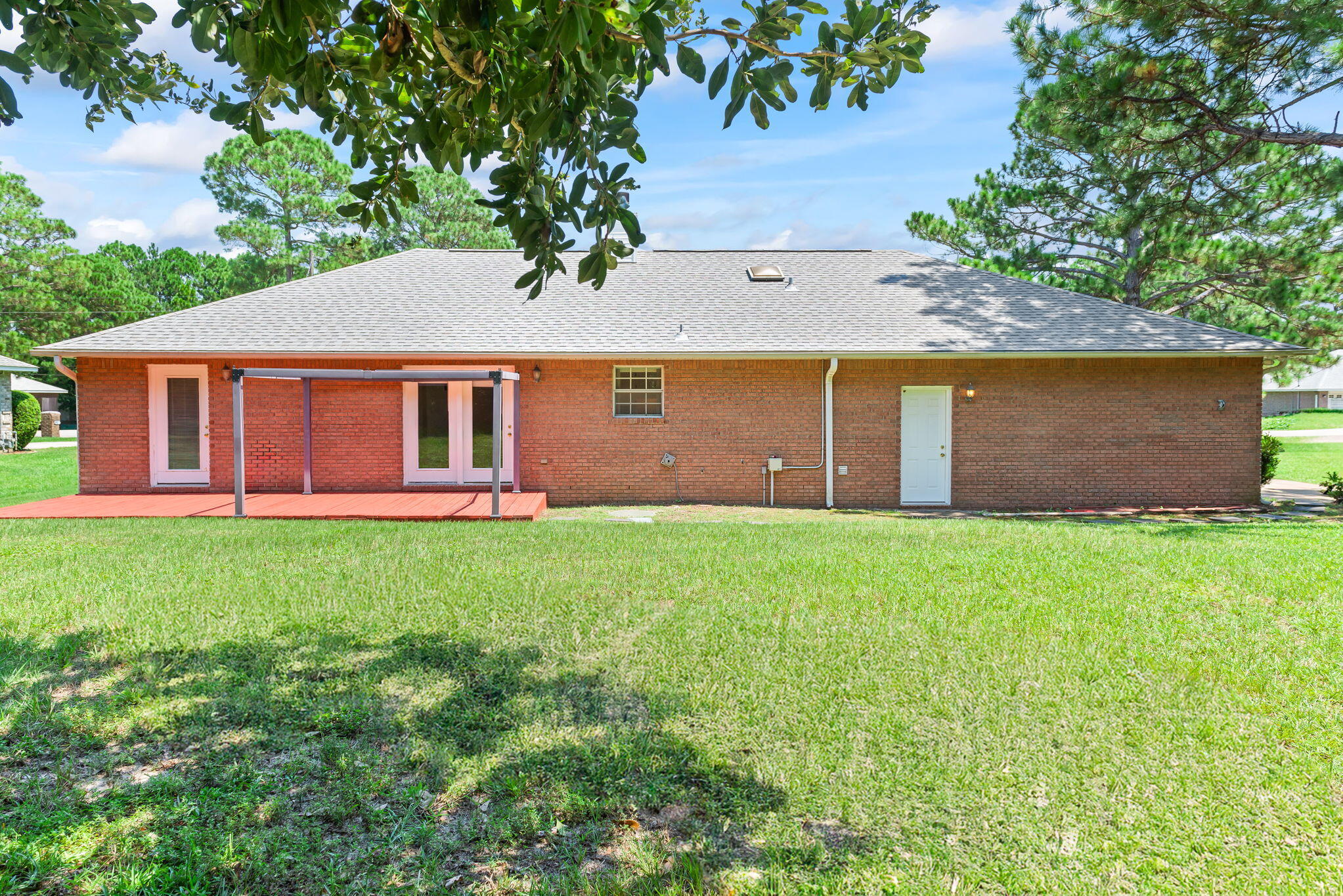 1931 Commodore Drive Navarre, FL 32566 - Photo 42 of 65 back of home and yard