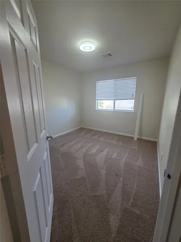 a view of a room that has a window