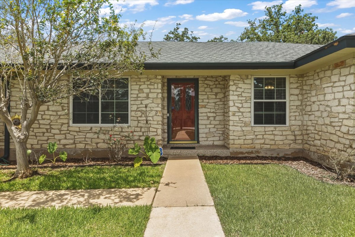 250 Hickory Drive Elgin, TX 78621 - Photo 2 of 37 a front view of a house with a yard