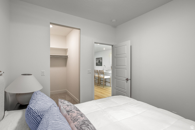 2768 Becco Trail, Unit 63 St. George, UT 84770 - Photo 15 of 27 Bedroom with a spacious closet and baseboards