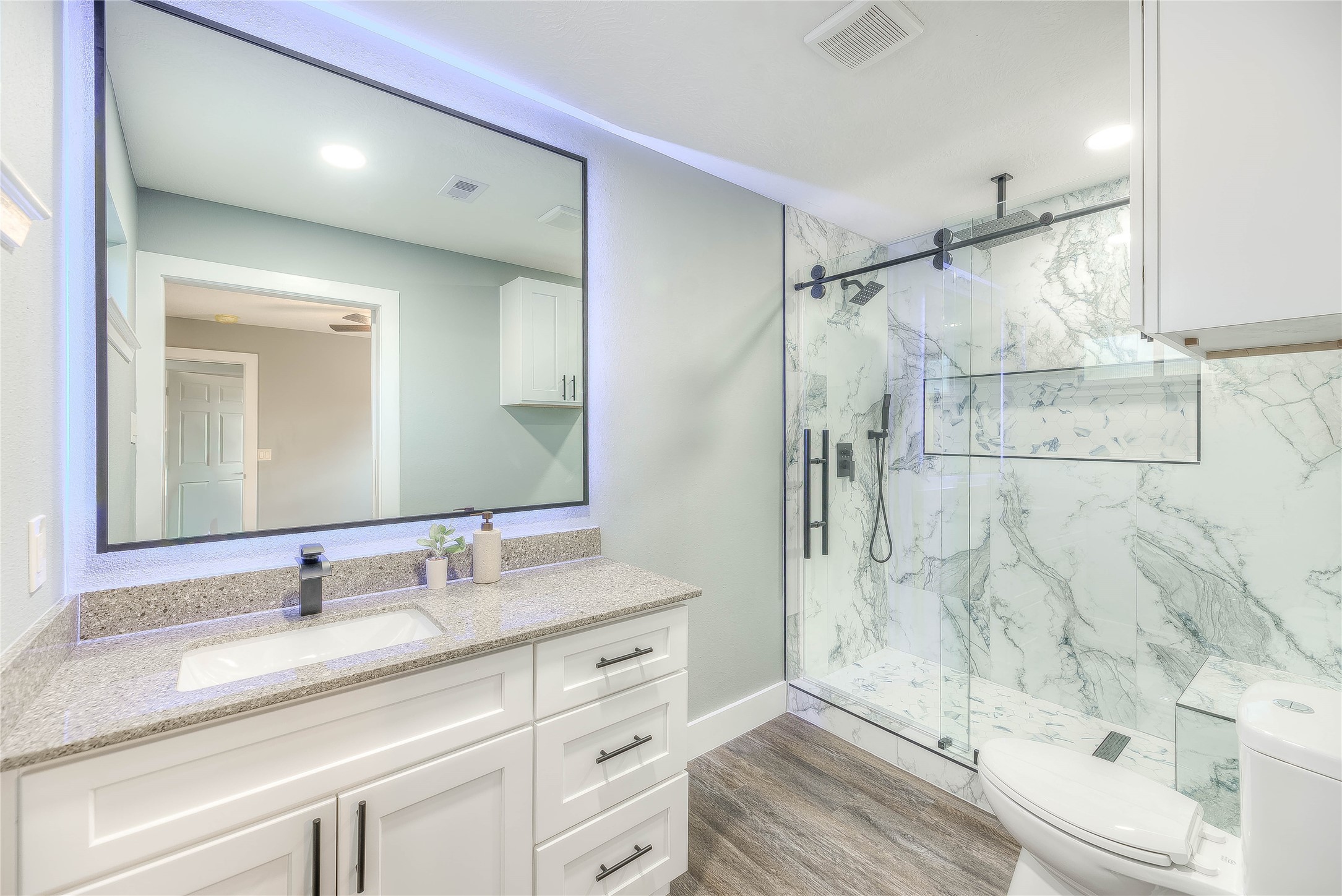 388 Sunrise Wood Road Goodrich, TX 77335 - Photo 5 of 33 a bathroom with a granite countertop sink mirror and shower