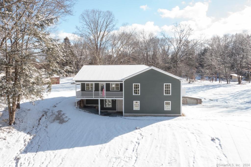 46 Cove Road East Haddam, CT 06469 - Photo 1 of 1 a view of a house with a yard covered in snow