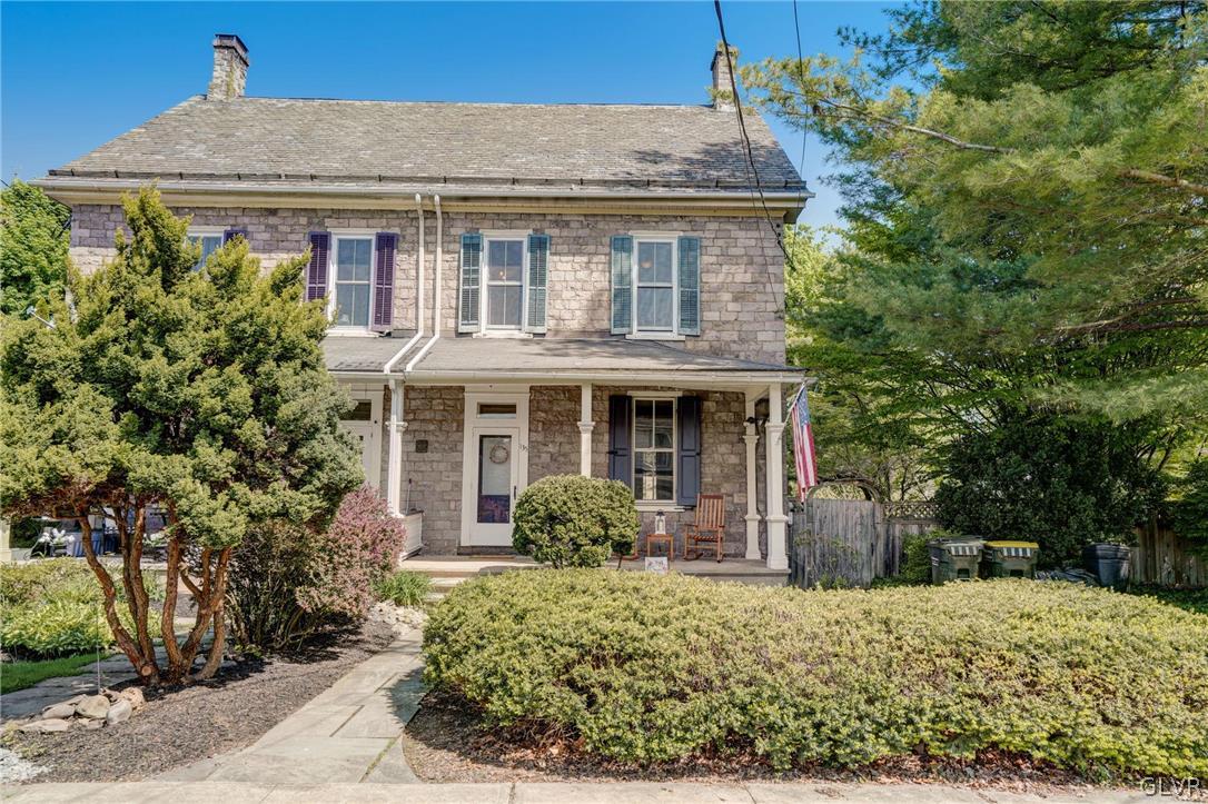 135 Delaware Road Riegelsville, PA 18077 - Photo 1 of 33 a front view of a house with garden