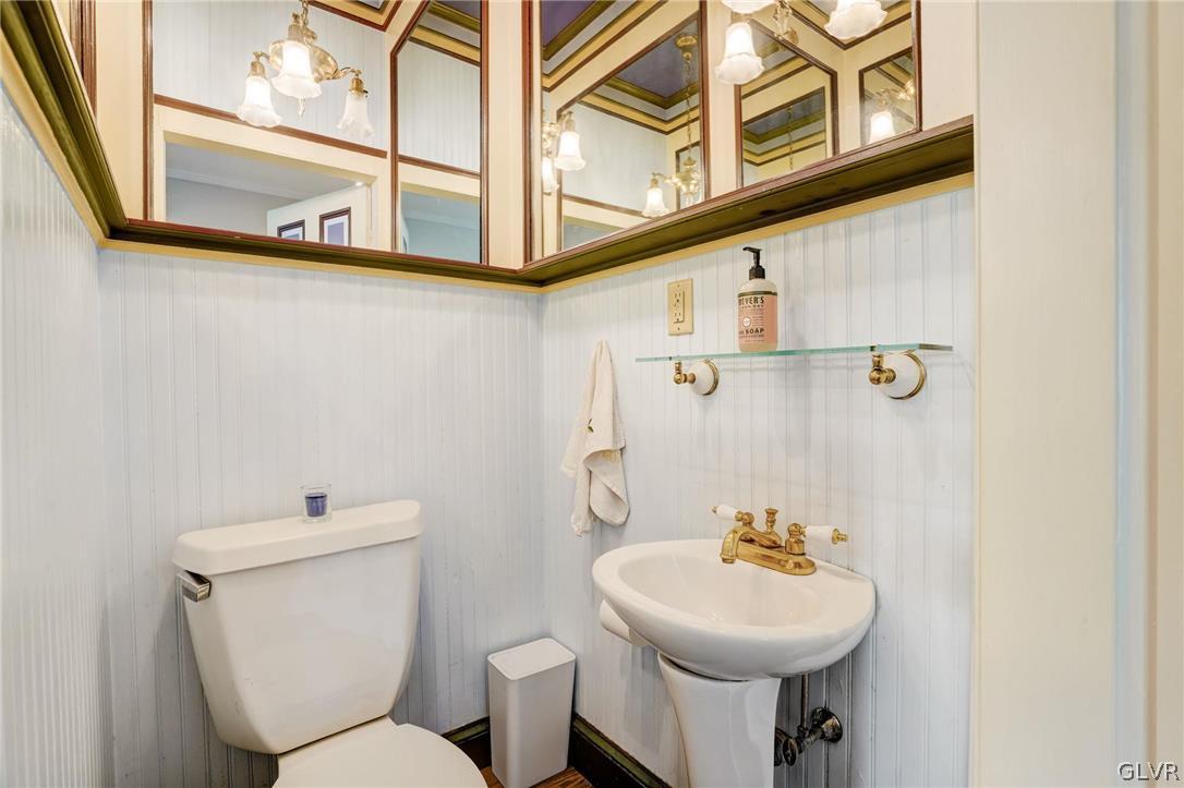 135 Delaware Road Riegelsville, PA 18077 - Photo 15 of 33 a bathroom with a sink mirror and toilet