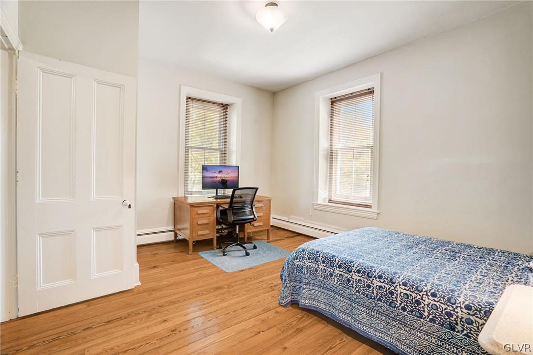 135 Delaware Road Riegelsville, PA 18077 - Photo 21 of 33 a bedroom with a bed and a window