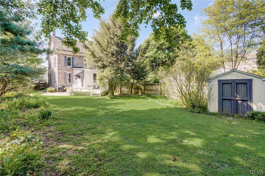 135 Delaware Road Riegelsville, PA 18077 - Photo 33 of 33 a view of a house with a big yard and large trees