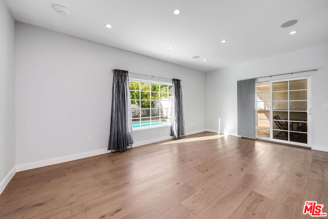 523 East Fairmount Road Burbank, CA 91501 - Photo 12 of 30 an empty room with wooden floor and windows