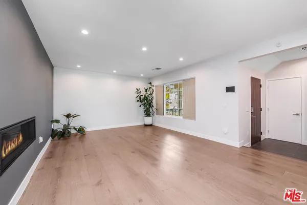 a view of livingroom with furniture window and wooden floor