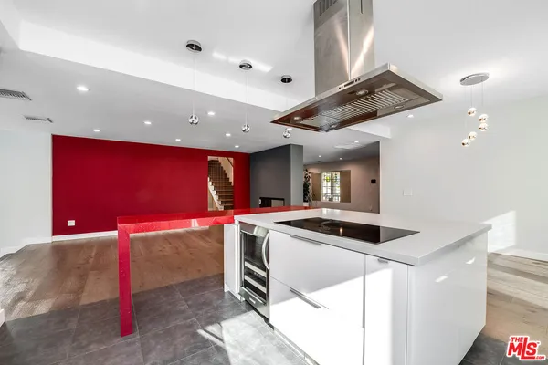 a kitchen that has a stove and a microwave