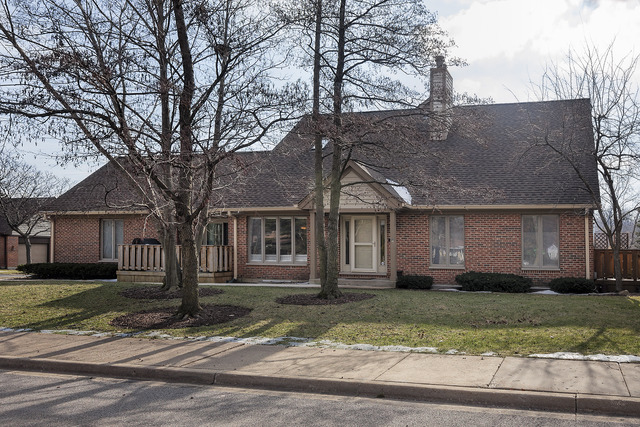 1943 Koehling Road Northbrook, IL 60062 - Photo 1 of 12 a front view of a house with a garden