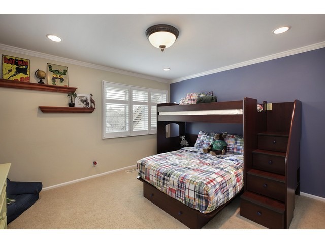 1943 Koehling Road Northbrook, IL 60062 - Photo 8 of 12 a bedroom with a bed and dresser