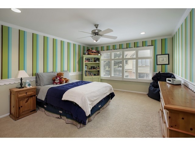 1943 Koehling Road Northbrook, IL 60062 - Photo 9 of 12 a bedroom with a large bed and a large window