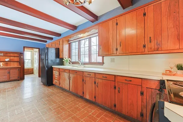 a kitchen with stainless steel appliances granite countertop a sink and cabinets