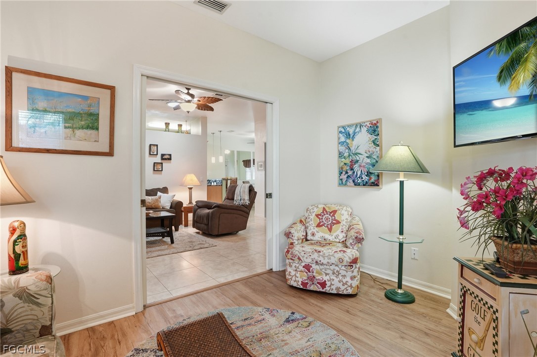 10730 Rio Mar Circle Estero, FL 33928 - Photo 8 of 47 a bedroom with furniture and a potted plant