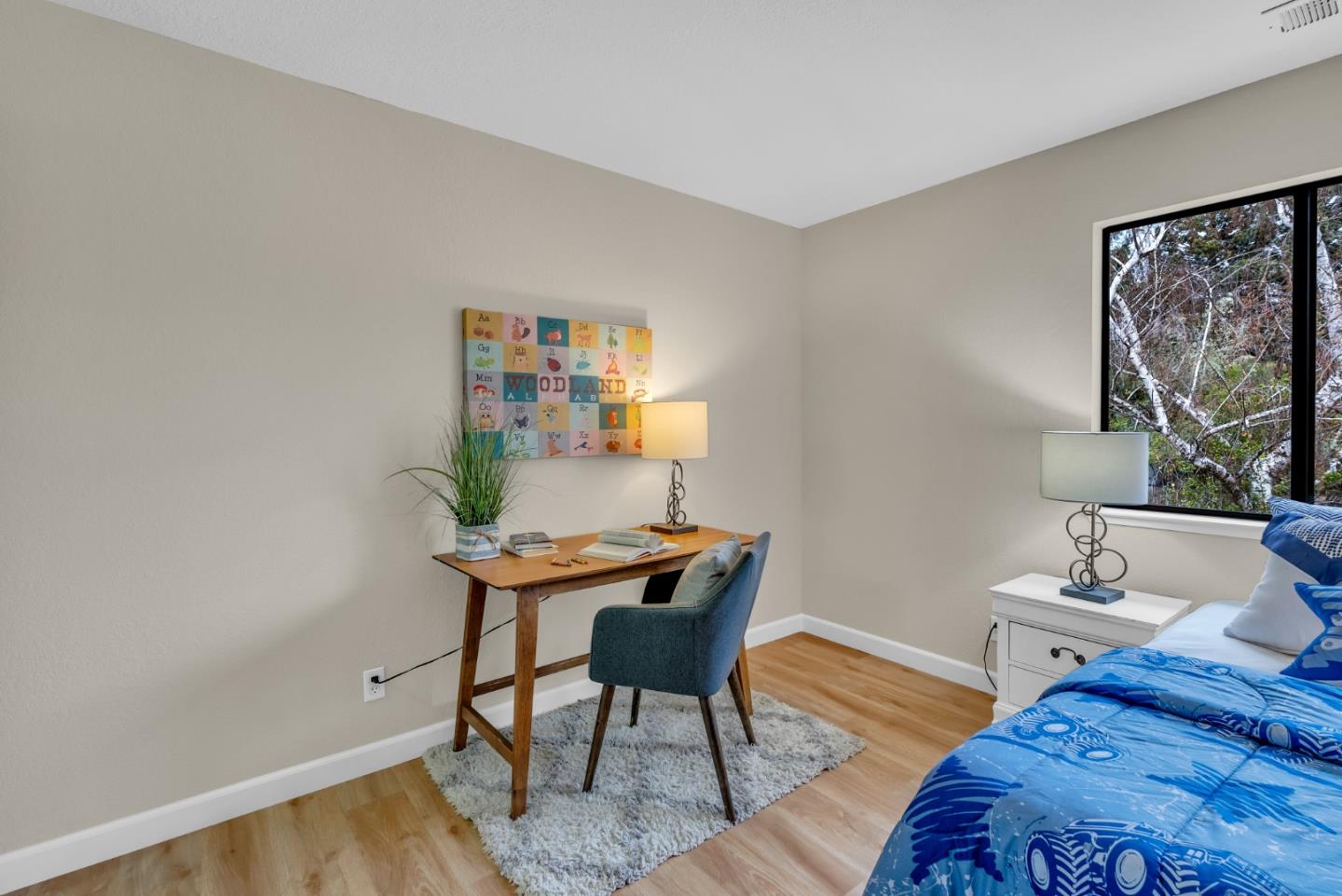 22483 McClellan Road Cupertino, CA 95014 - Photo 14 of 38 a bedroom with a bed and a table in it