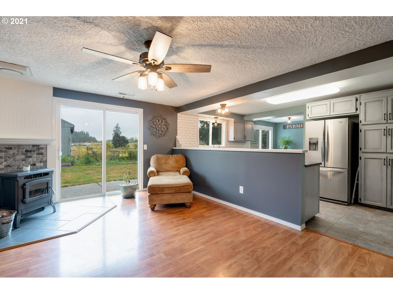 805 Northeast 209th Street Ridgefield, WA 98642 - Photo 14 of 32 a living room with furniture and a floor to ceiling window