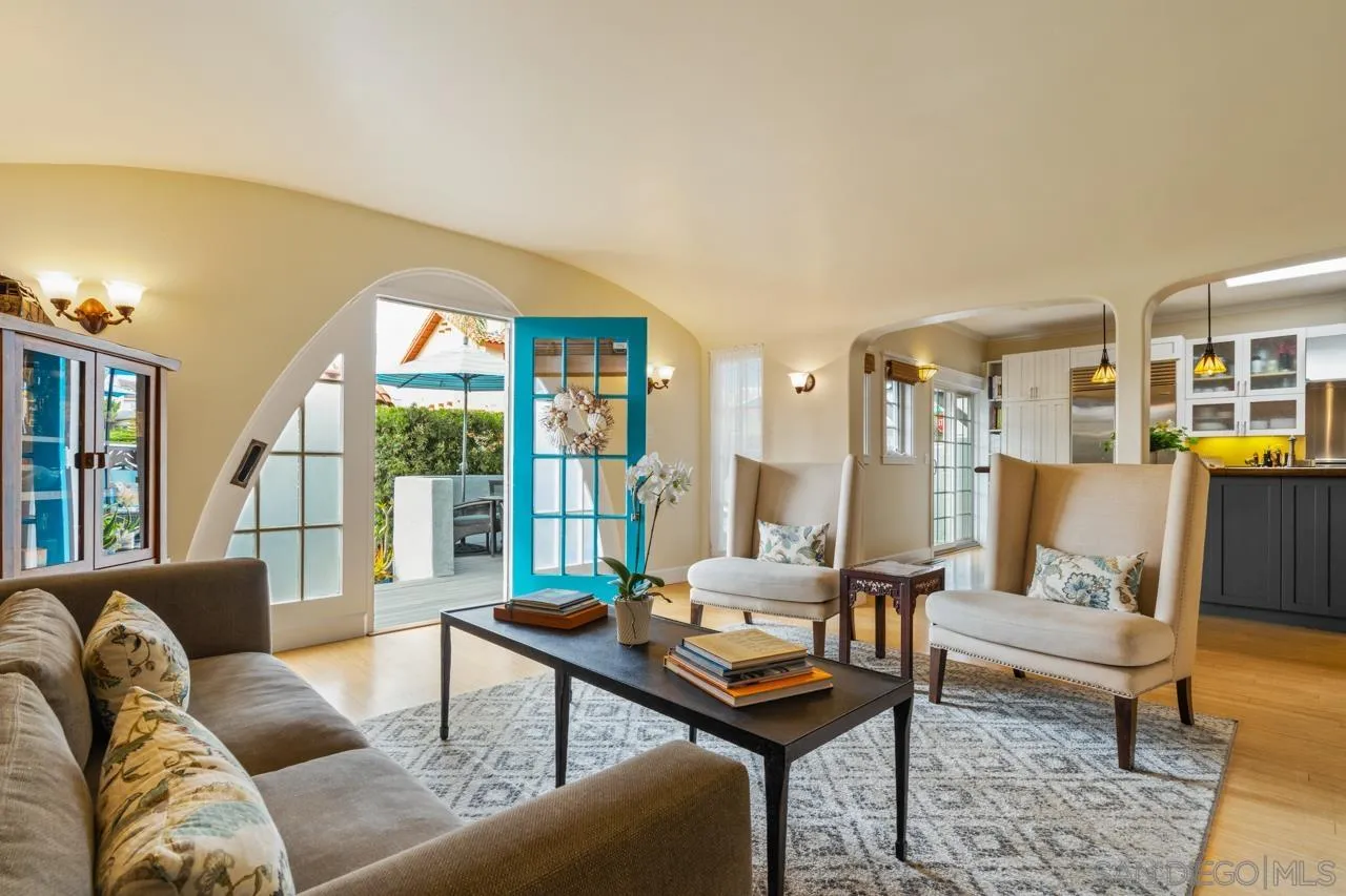 425 Sea Lane La Jolla, CA 92037 - Photo 11 of 41 a living room with furniture and a floor to ceiling window