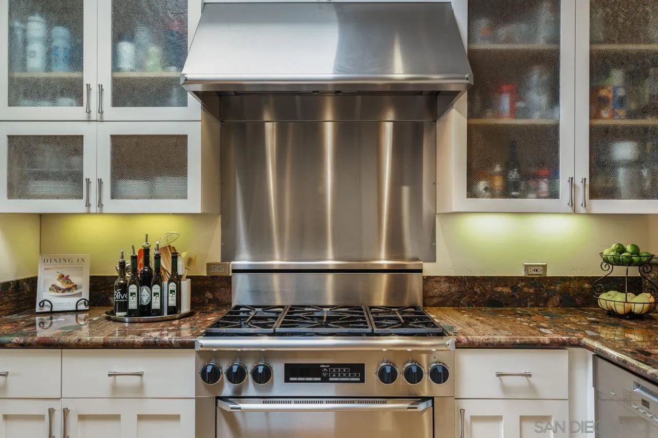 425 Sea Lane La Jolla, CA 92037 - Photo 18 of 41 a stove top oven sitting inside of a kitchen