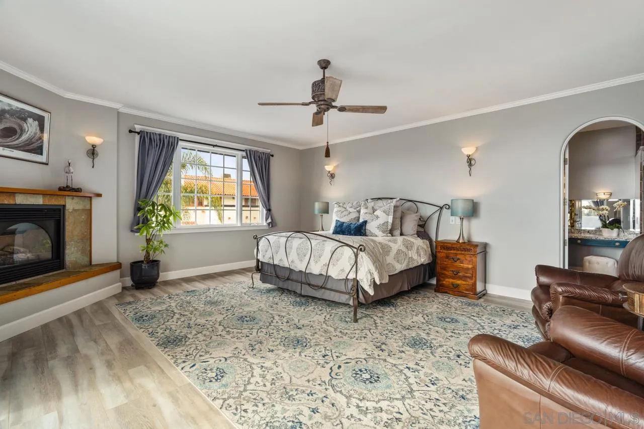 425 Sea Lane La Jolla, CA 92037 - Photo 22 of 41 a bedroom with a bed couch and window