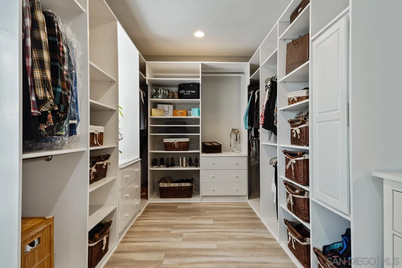 425 Sea Lane La Jolla, CA 92037 - Photo 27 of 41 a view of walk in closet with clothes and shoes