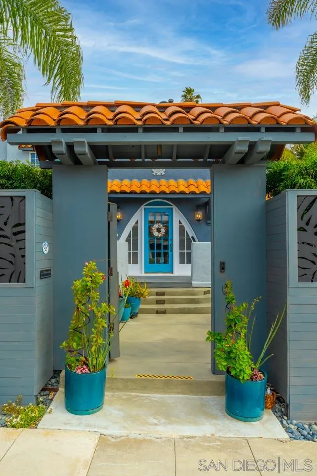 425 Sea Lane La Jolla, CA 92037 - Photo 4 of 41 a view of a house with many windows and plants