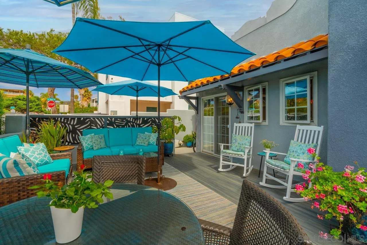 425 Sea Lane La Jolla, CA 92037 - Photo 8 of 41 an outdoor space with furniture and umbrella