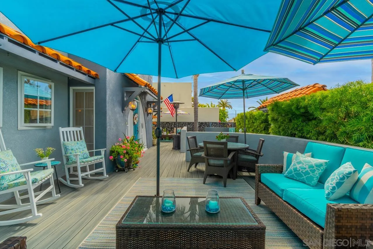 425 Sea Lane La Jolla, CA 92037 - Photo 9 of 41 a view of an outdoor sitting area with furniture and umbrella