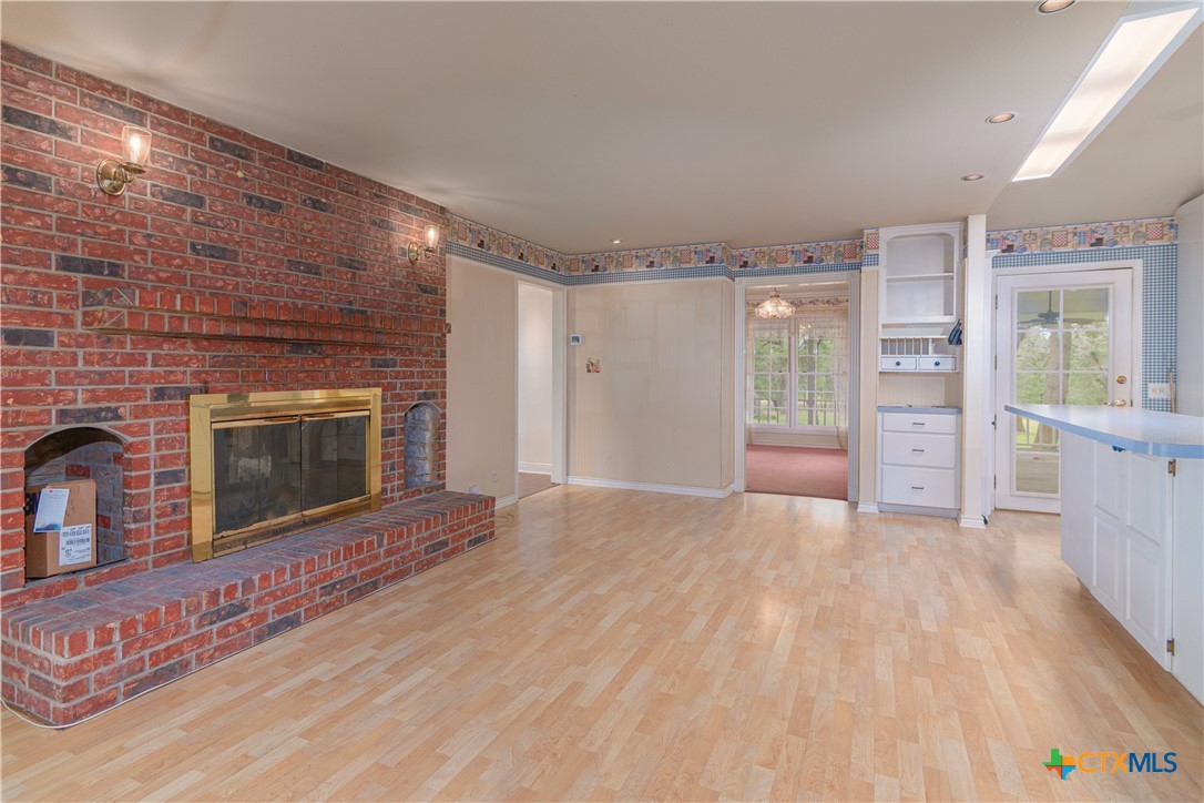 2981 Vivroux Ranch Road Seguin, TX 78155 - Photo 15 of 43 a view of an empty room with a fireplace and a window