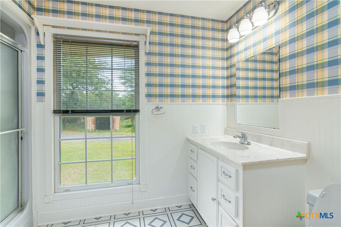 2981 Vivroux Ranch Road Seguin, TX 78155 - Photo 22 of 43 a bathroom with a sink and a window